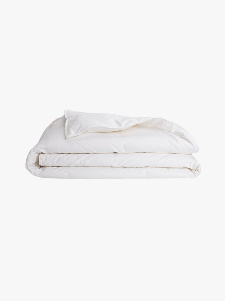 Brooklinen Lightweight Down Comforter folded white comforter on light gray background
